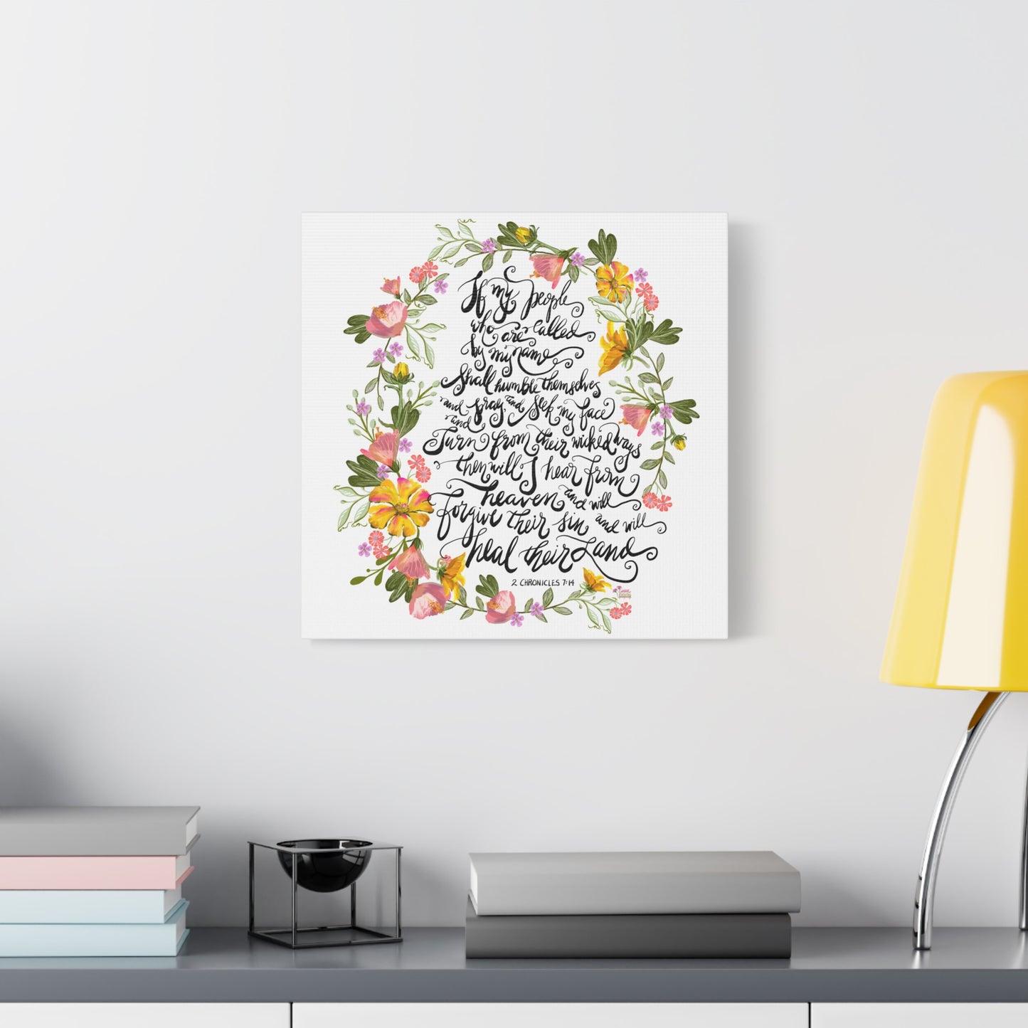 Decorative wall art with floral design and Bible Verse text on a white wall above a shelf: If my people who are called by my name shall humble themselves and pray