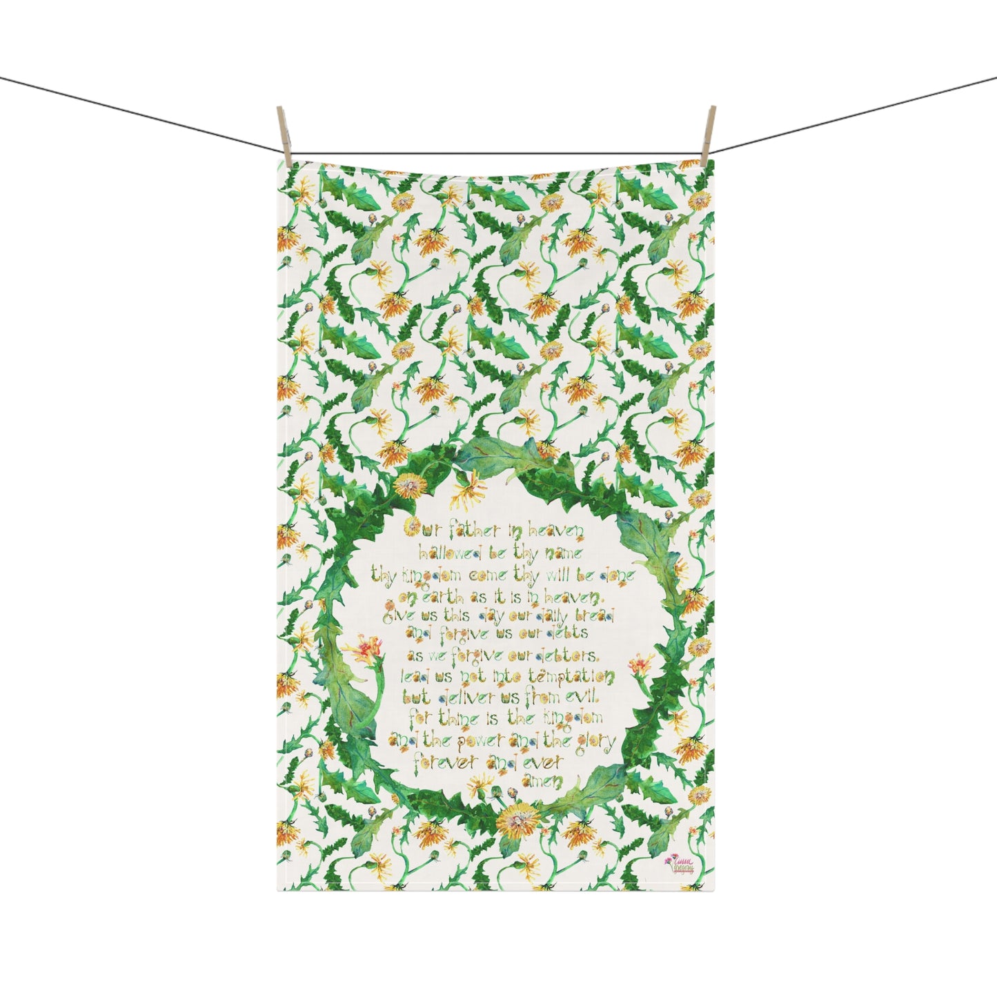 Floral patterned kitchen towel with The Lord's Prayer and dandelions on a white background