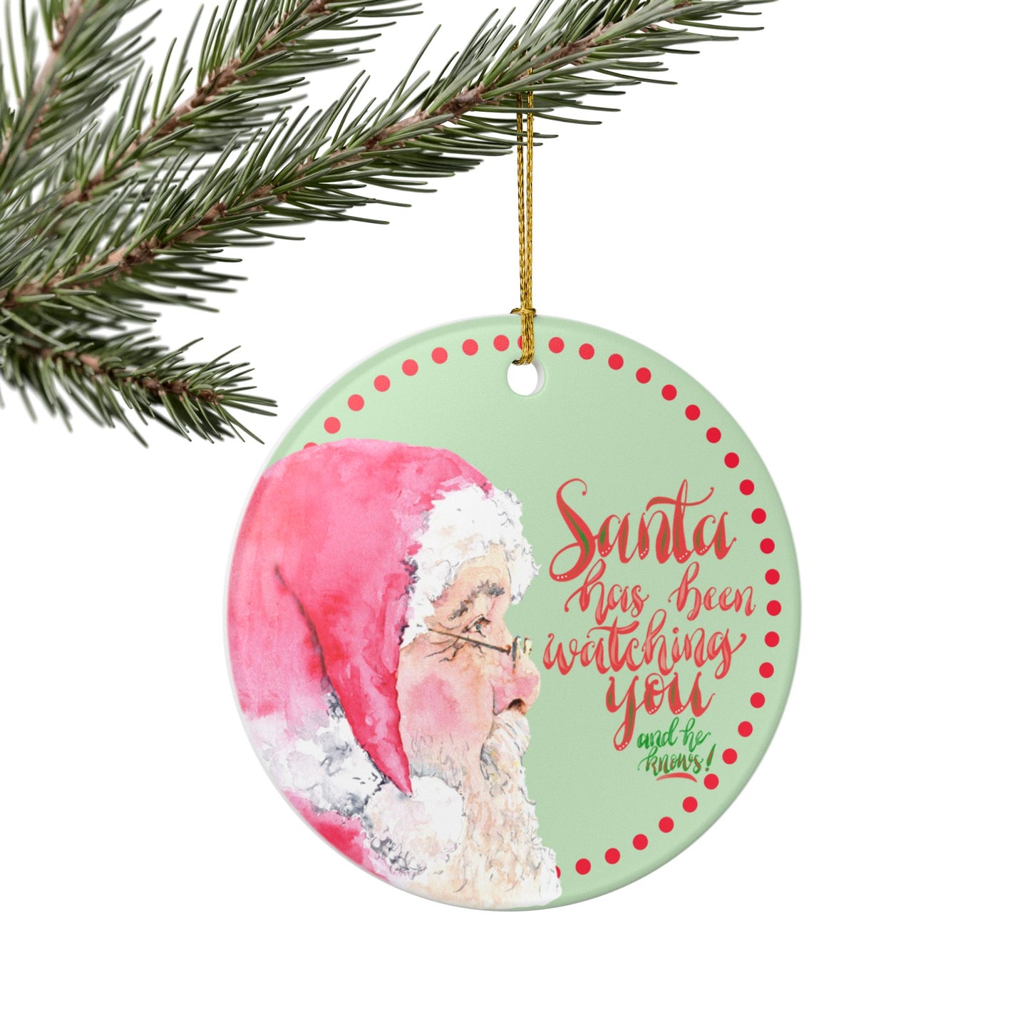 Christmas ornament with Santa Claus and text 'Santa has been watching you and he knows on a green background.