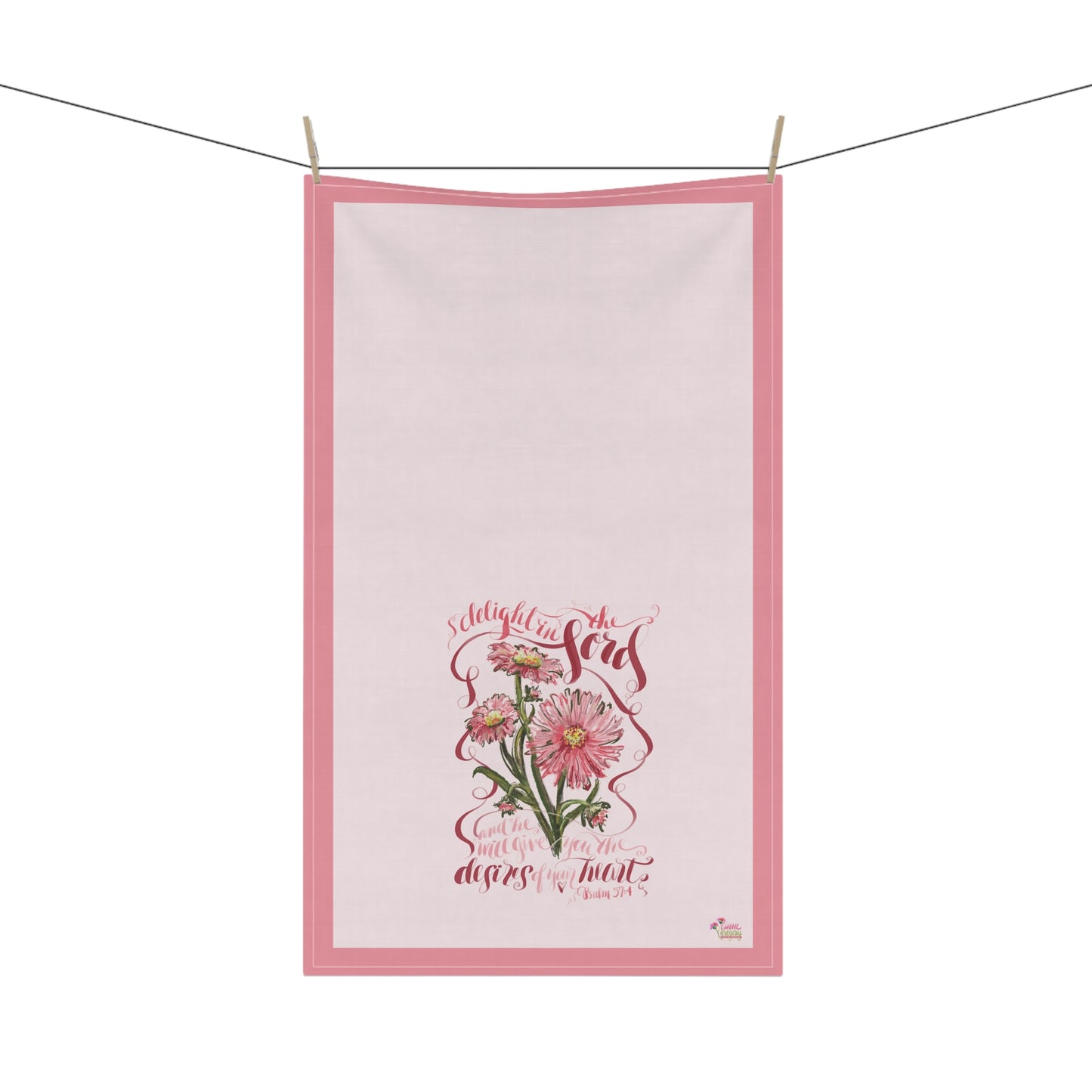 Floral-themedtea towel with Bible Vverse about the desires of the heart on a white background