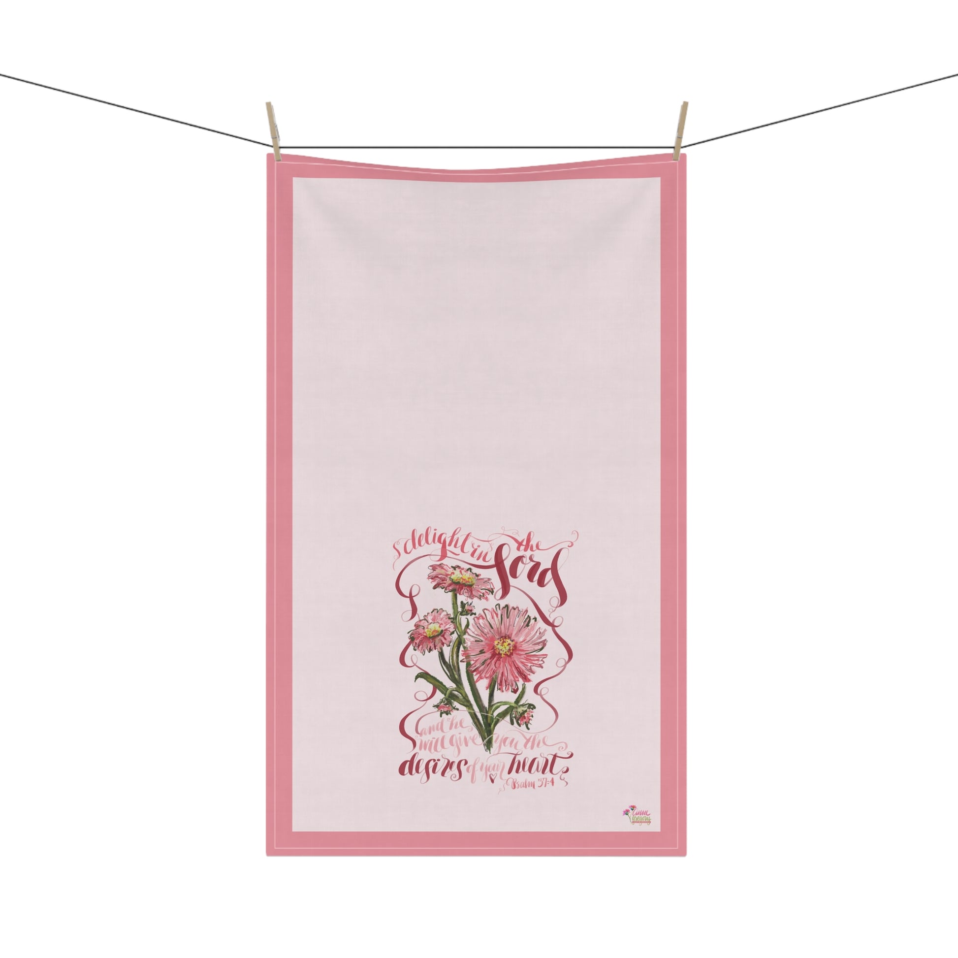 Floral-themedtea towel with Bible Vverse about the desires of the heart on a white background