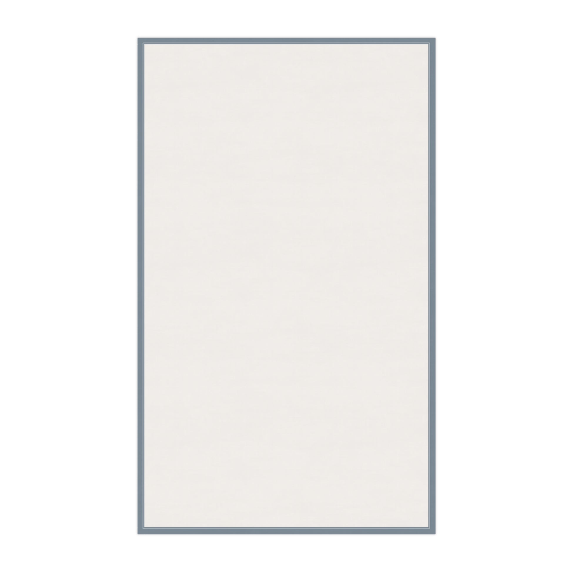 Backside of tea towel that is white and a blue border on a white background