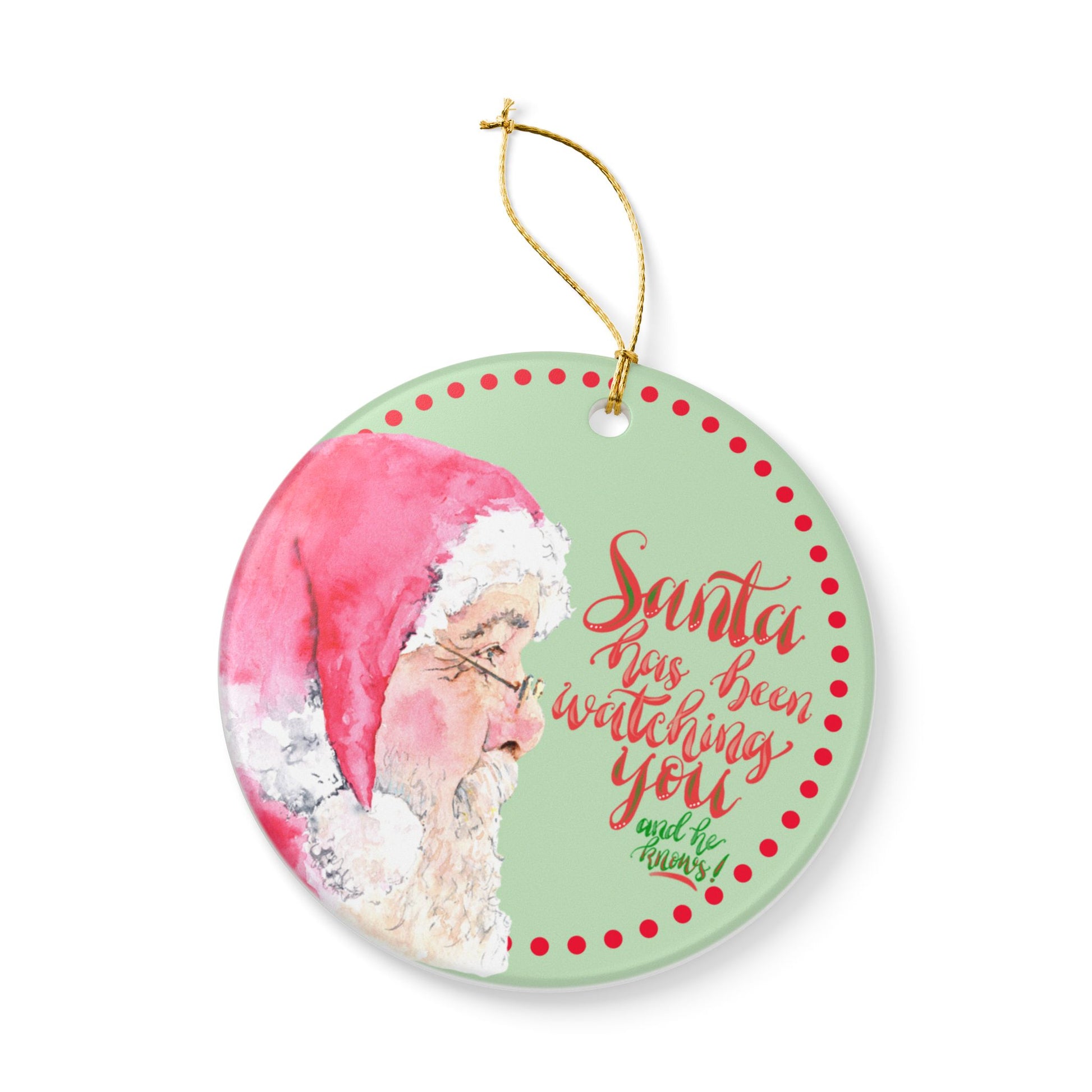Decorative Christmas ornament with Santa Claus and text on a green background