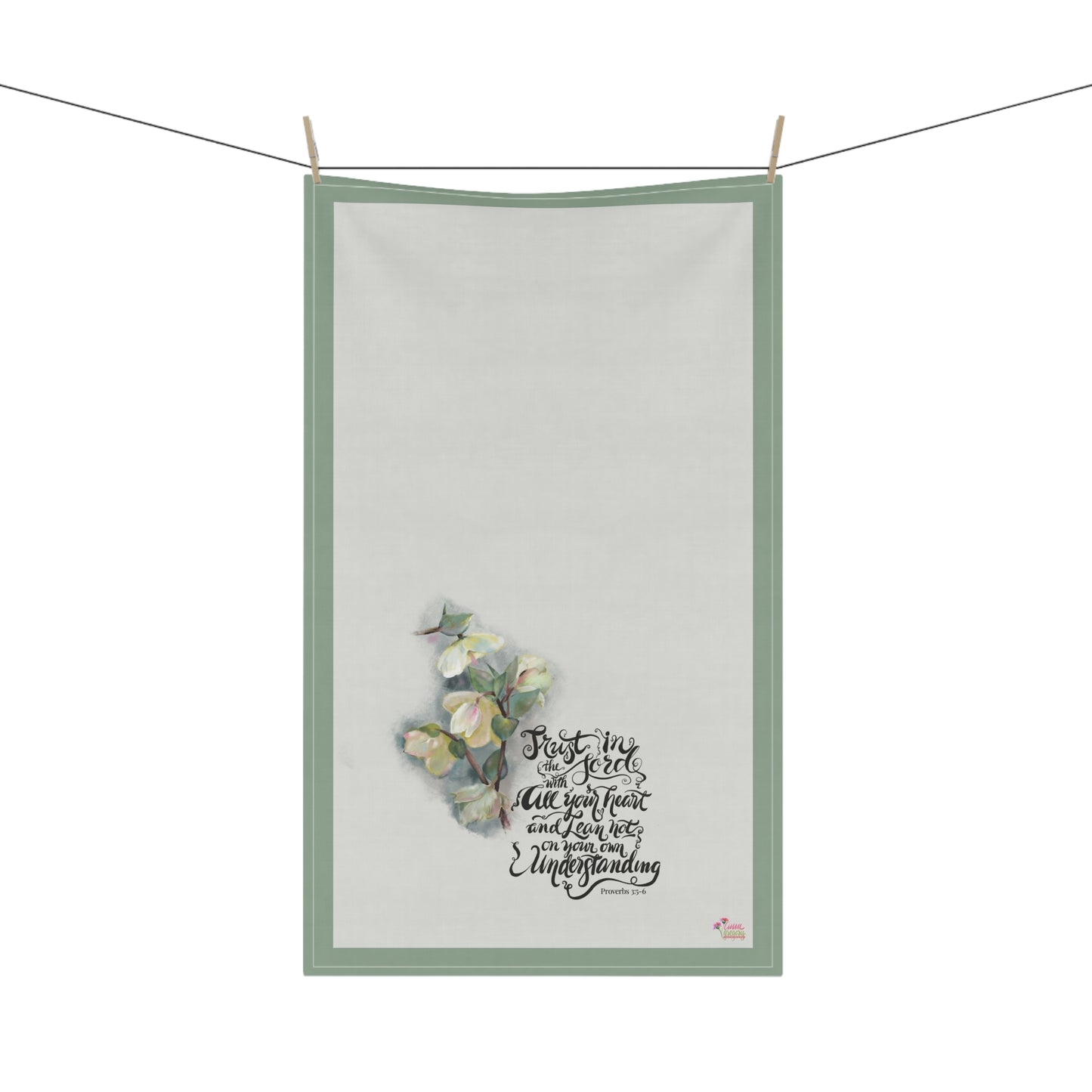 Kitchen tea towel with Bible verse Trust in the Lord with all your heart" and floral painting on a white background