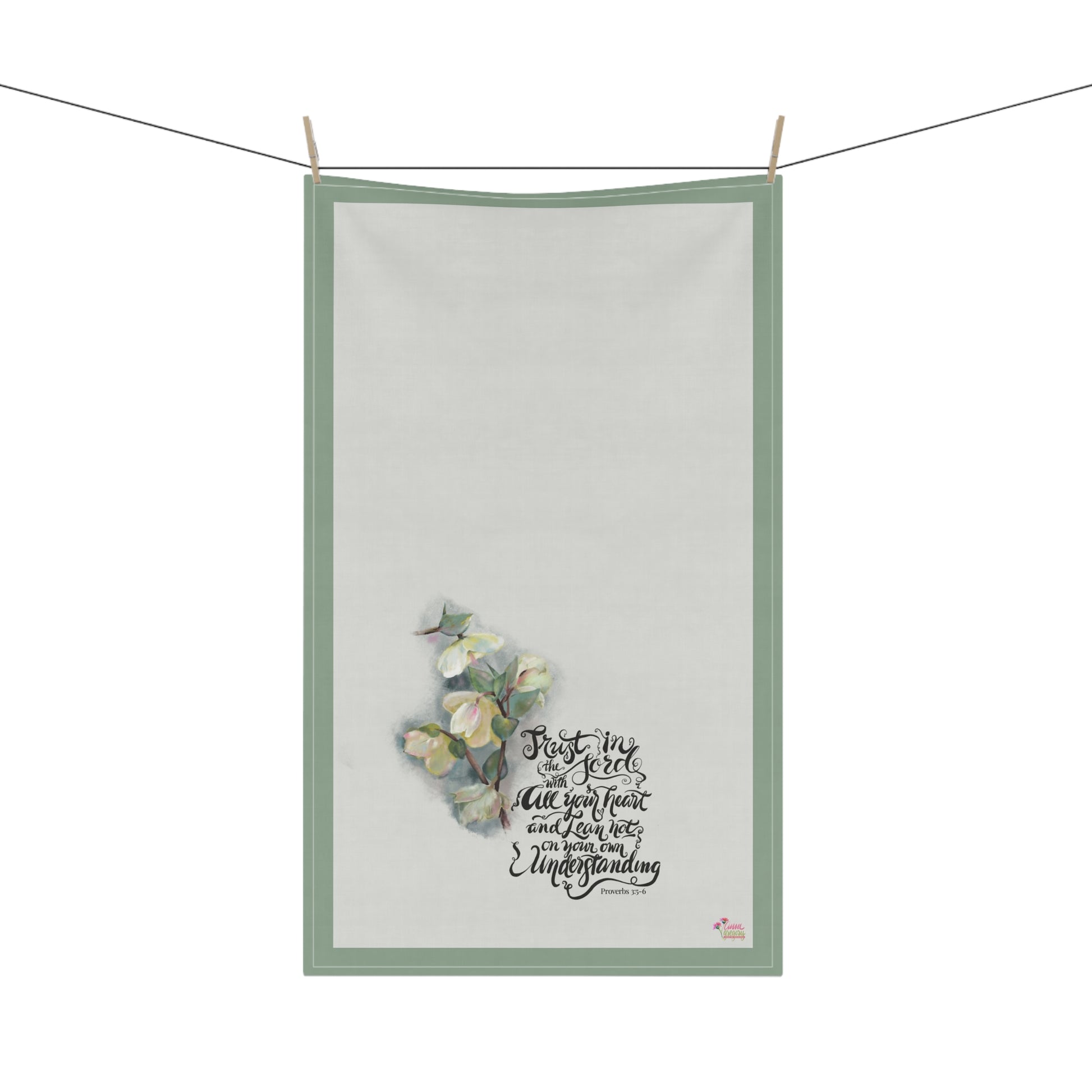 Kitchen tea towel with Bible verse Trust in the Lord with all your heart" and floral painting on a white background