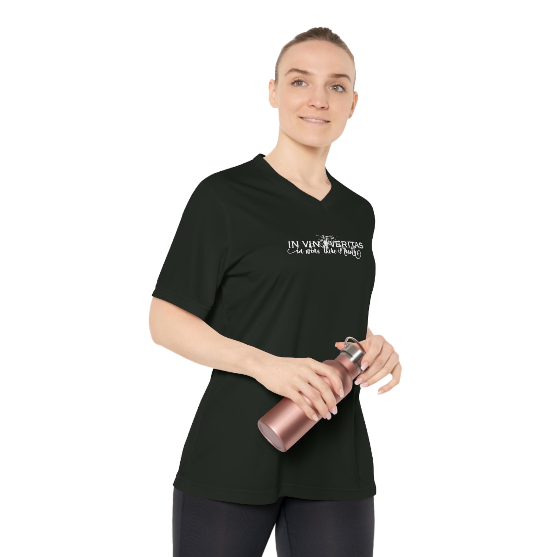 Person wearing a black wine themed  t-shirt with text, holding a pink water bottle on a white background