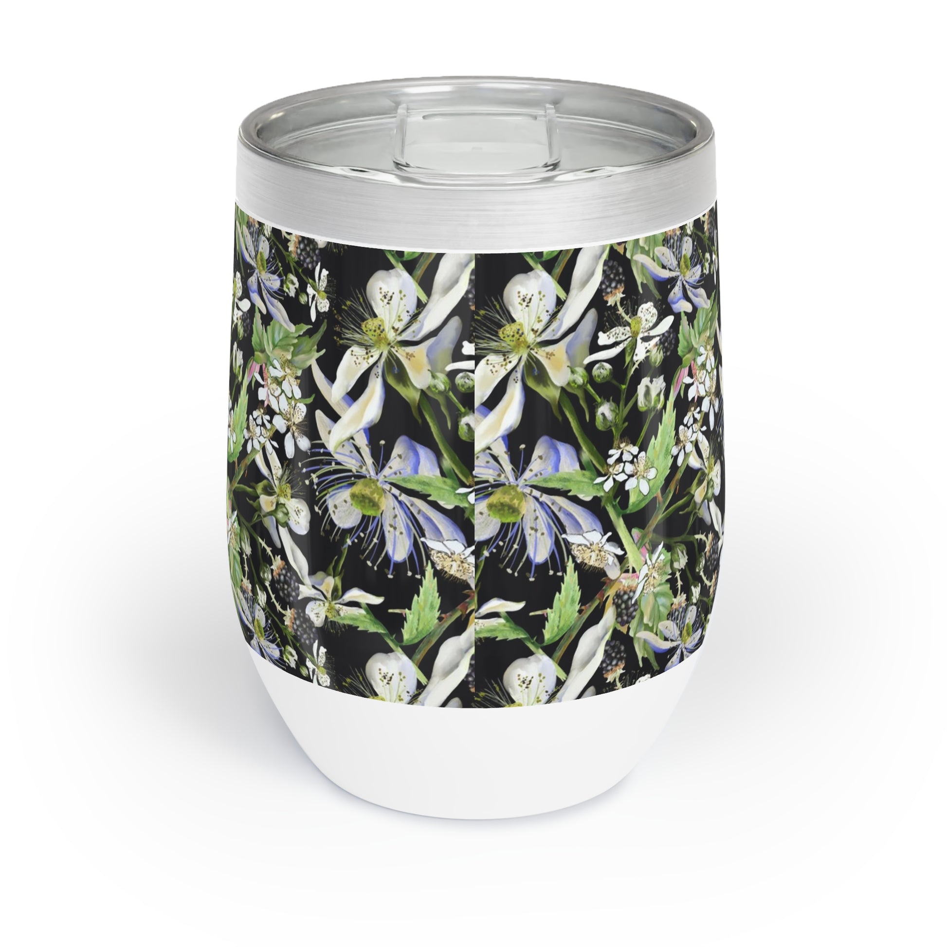 White tumbler with floral design on a black background