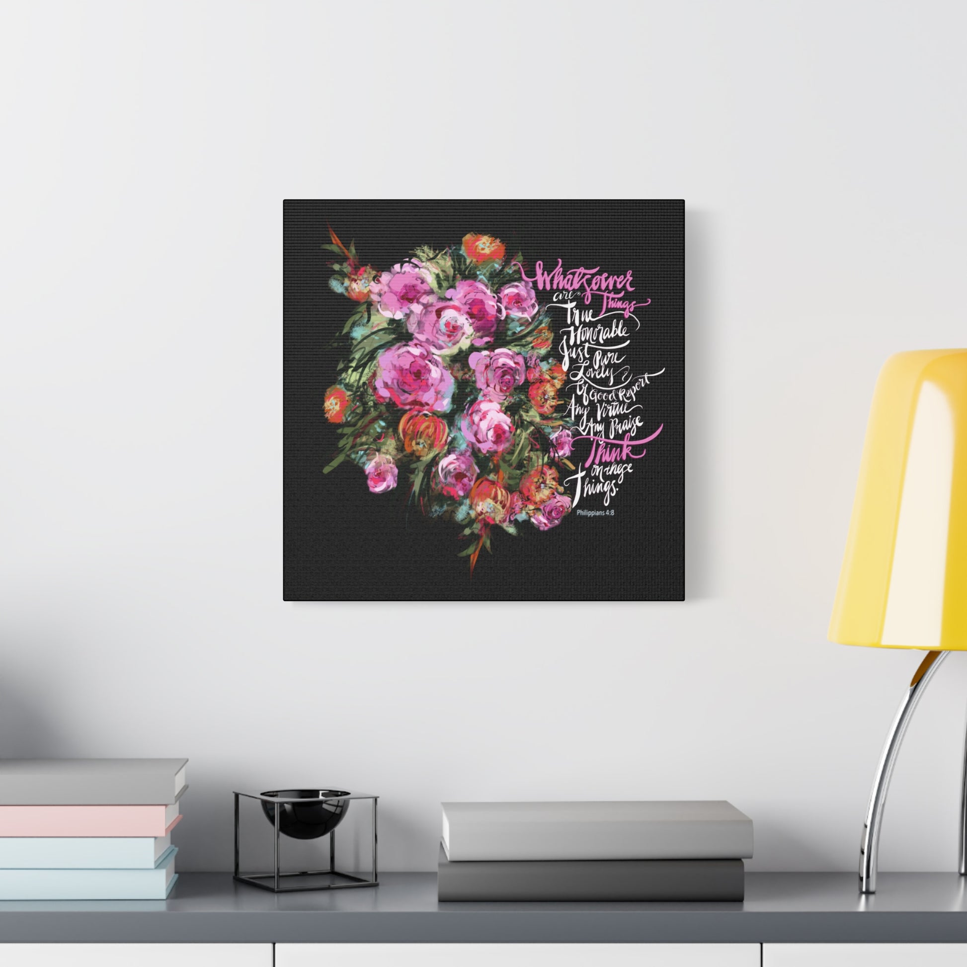 Floral artwork with Bible verse text, Whatseover Things, on a black background in a modern interior setting.