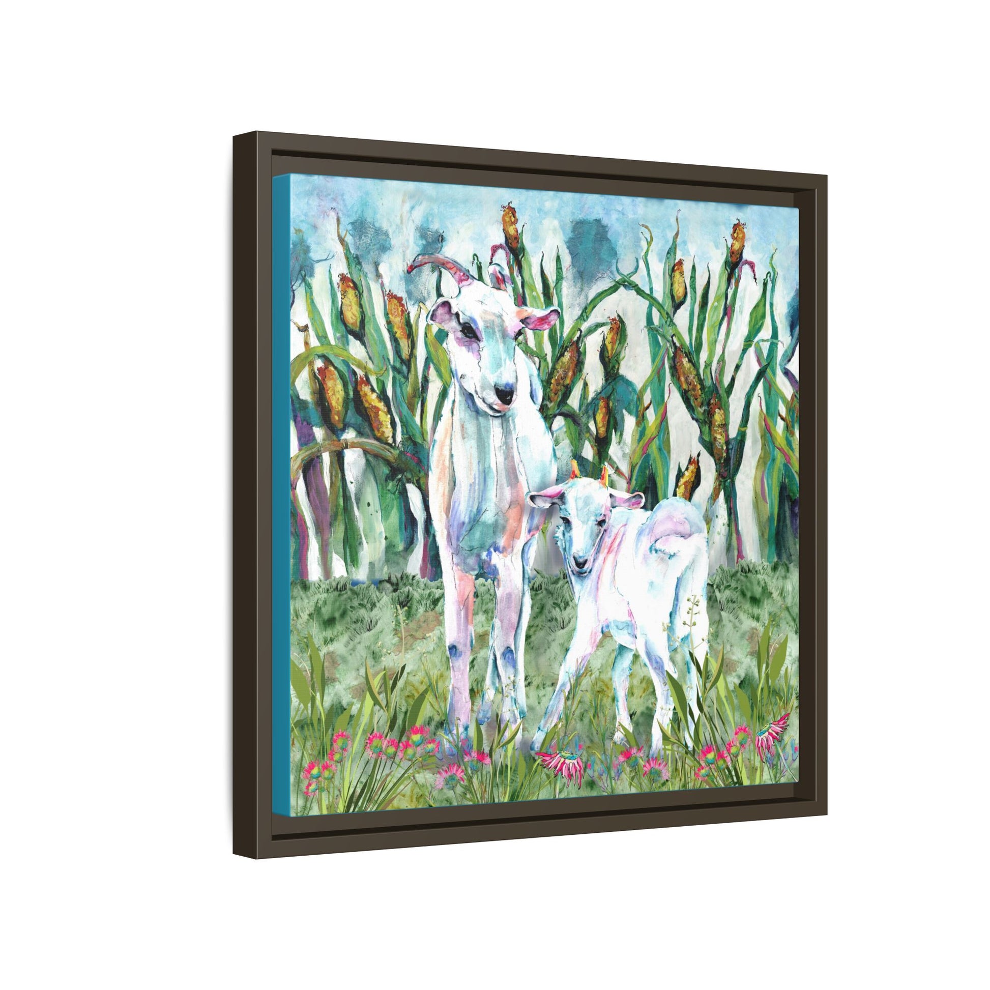 Side view Framed artwork of two goats in a grassy field with flowers and cattails. Espresso frame