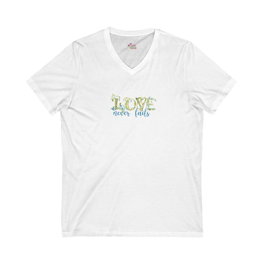White t-shirt with 'Love never fails' text on a white background
